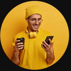 Man holding two phones